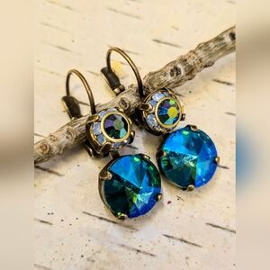 Sparkling Blue Flower Crystals In Drop Down Brass Earrings
